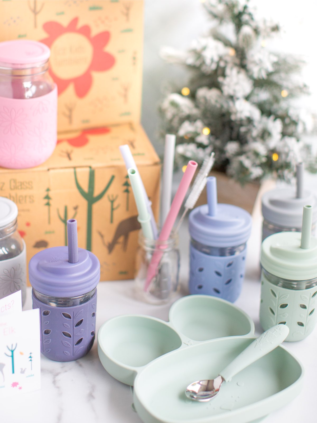 Eco-friendly kids cups and silicone bunny plates from Elk & Friends in a holiday scene.
