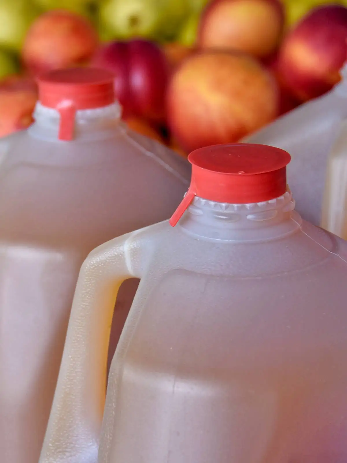 Apple juice in one gallon plastic jugs.