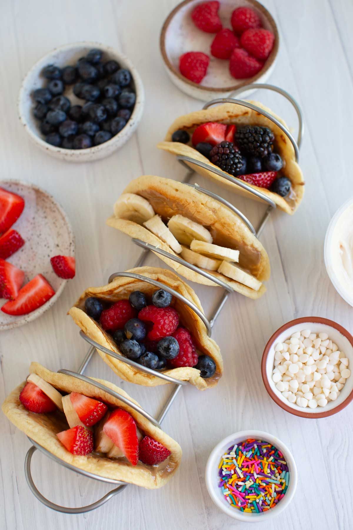 A top-down shot of pancake tacos in a taco holder.