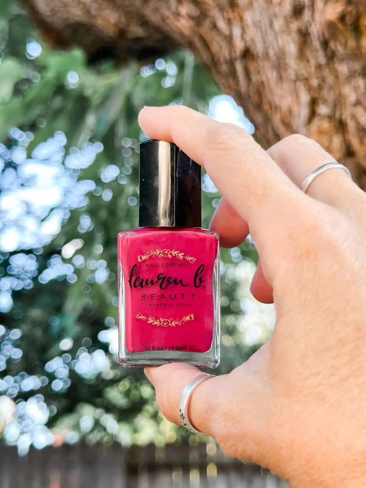 Hot pink nail polish by Lauren B Cosmetics.