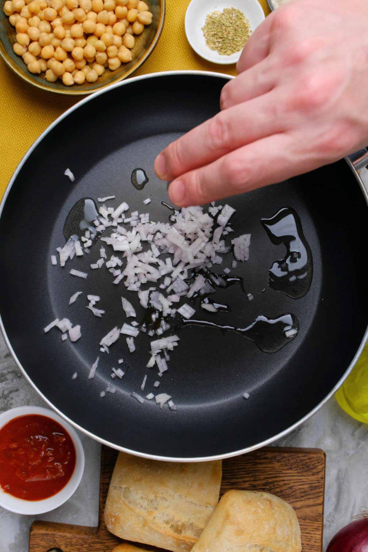 Minced shallots in a non-stick skillet.