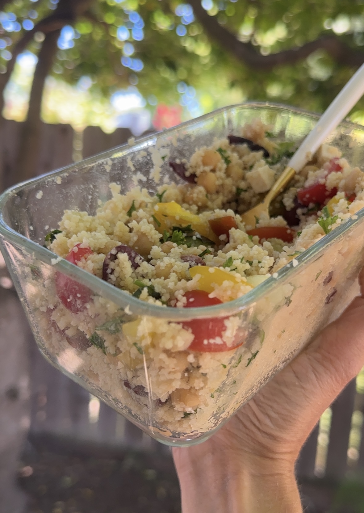 Meal prepped couscous bowls after cooking the couscous and fluffing everything together with a fork.