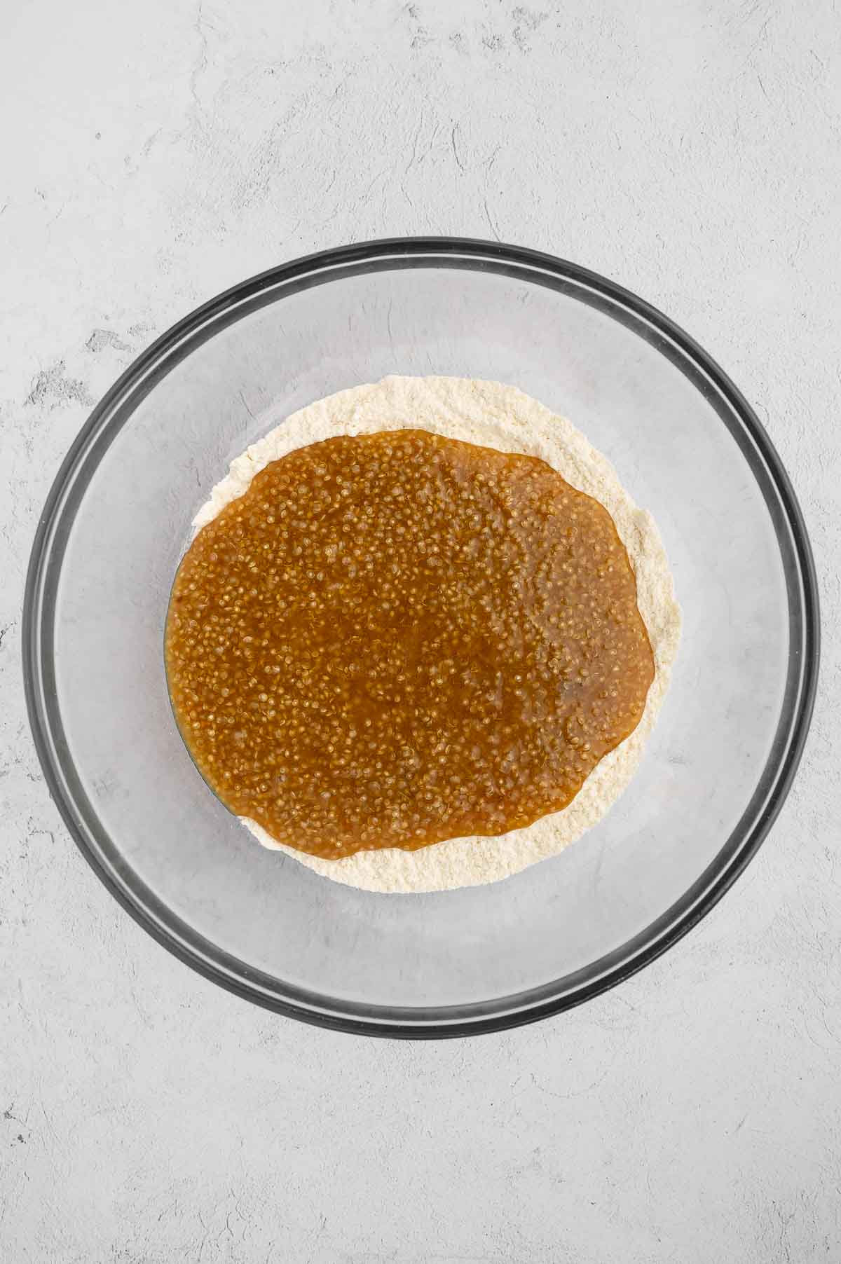 Quinoa batter in a bowl with flour.