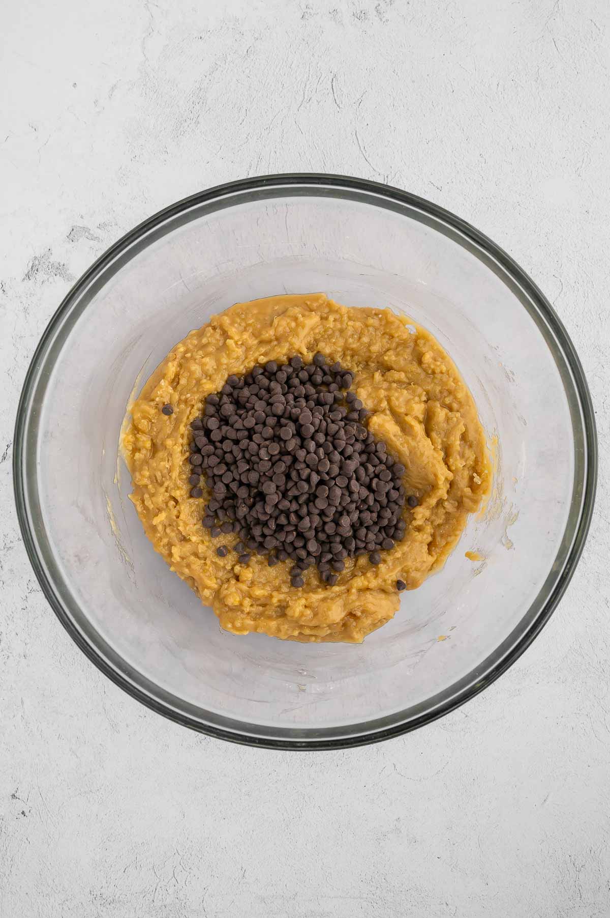 Quinoa cookie dough with vegan chocolate chips in a bowl.