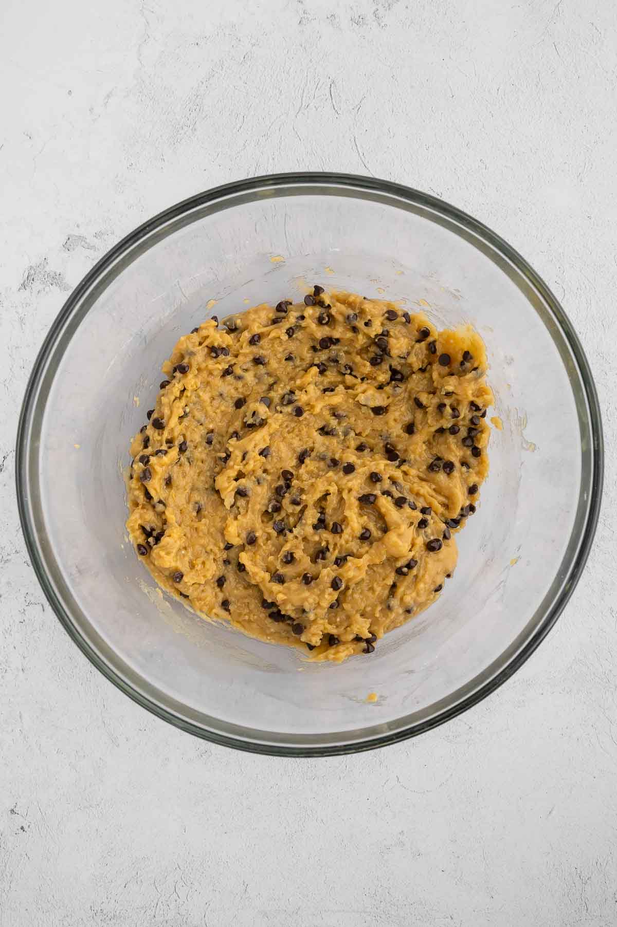 Quinoa cookie batter with chocolate chips.