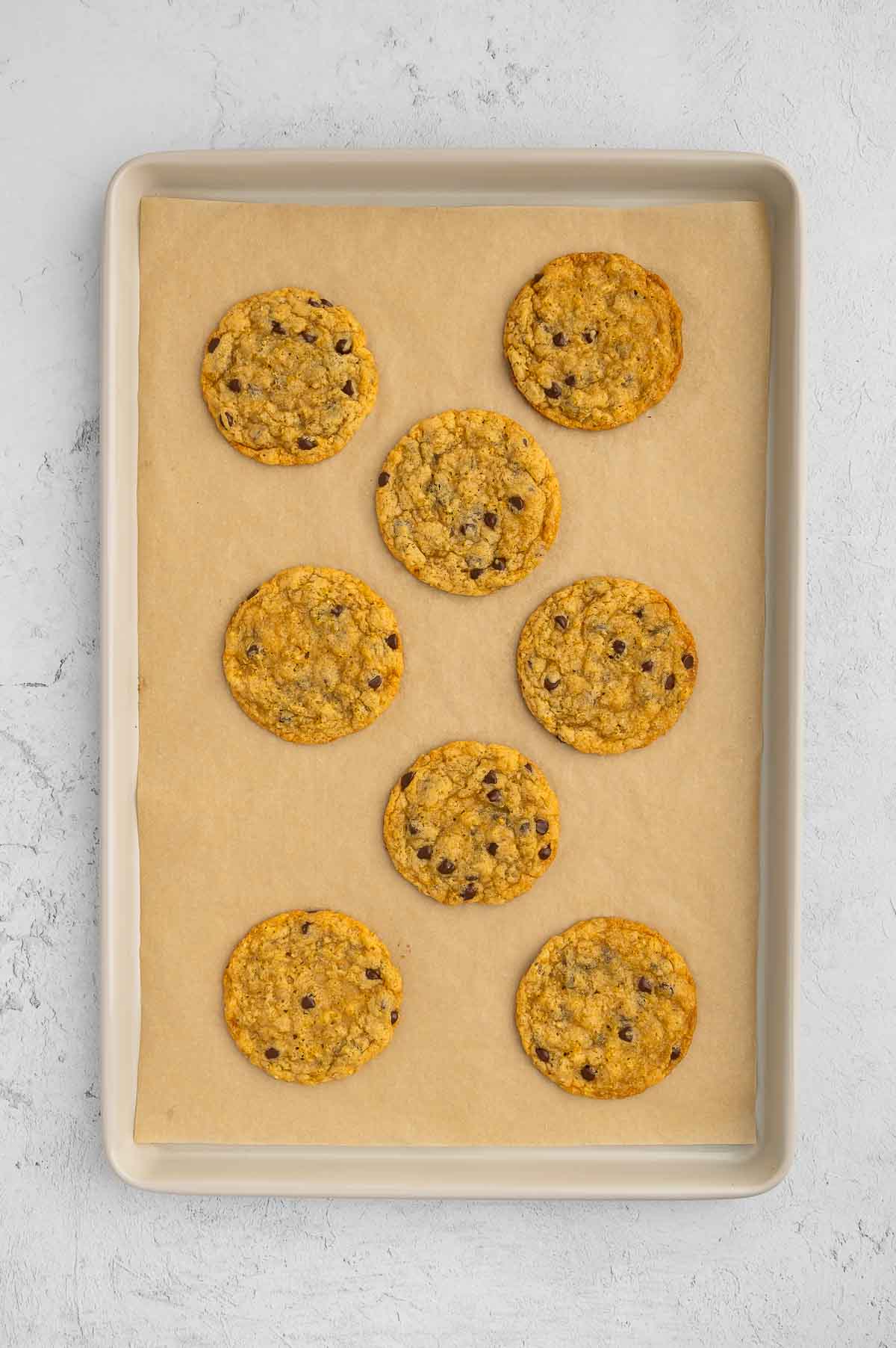 Baked quinoa cookies on a baking sheet.