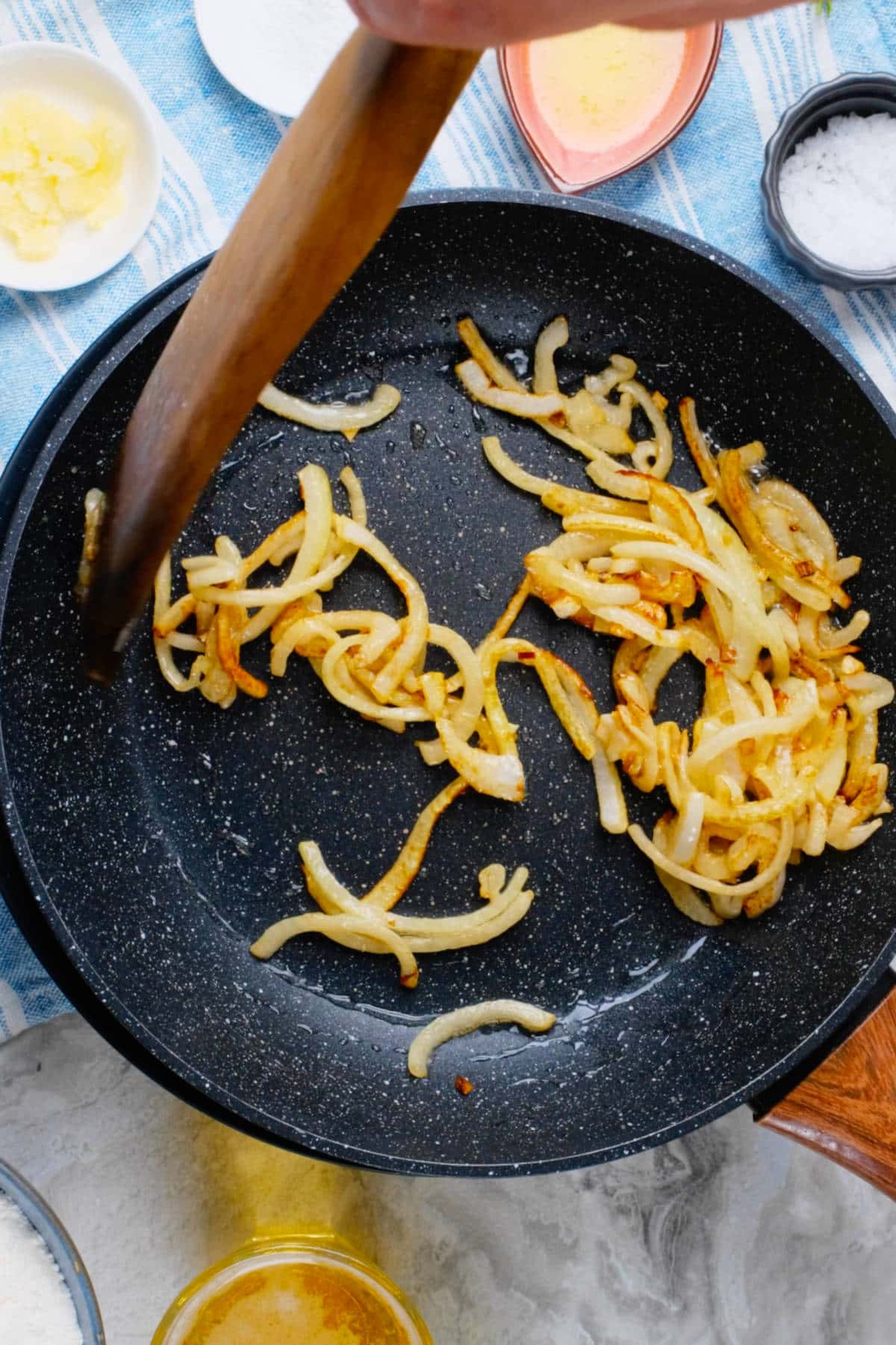 Caramelized onion slices in a skillet.
