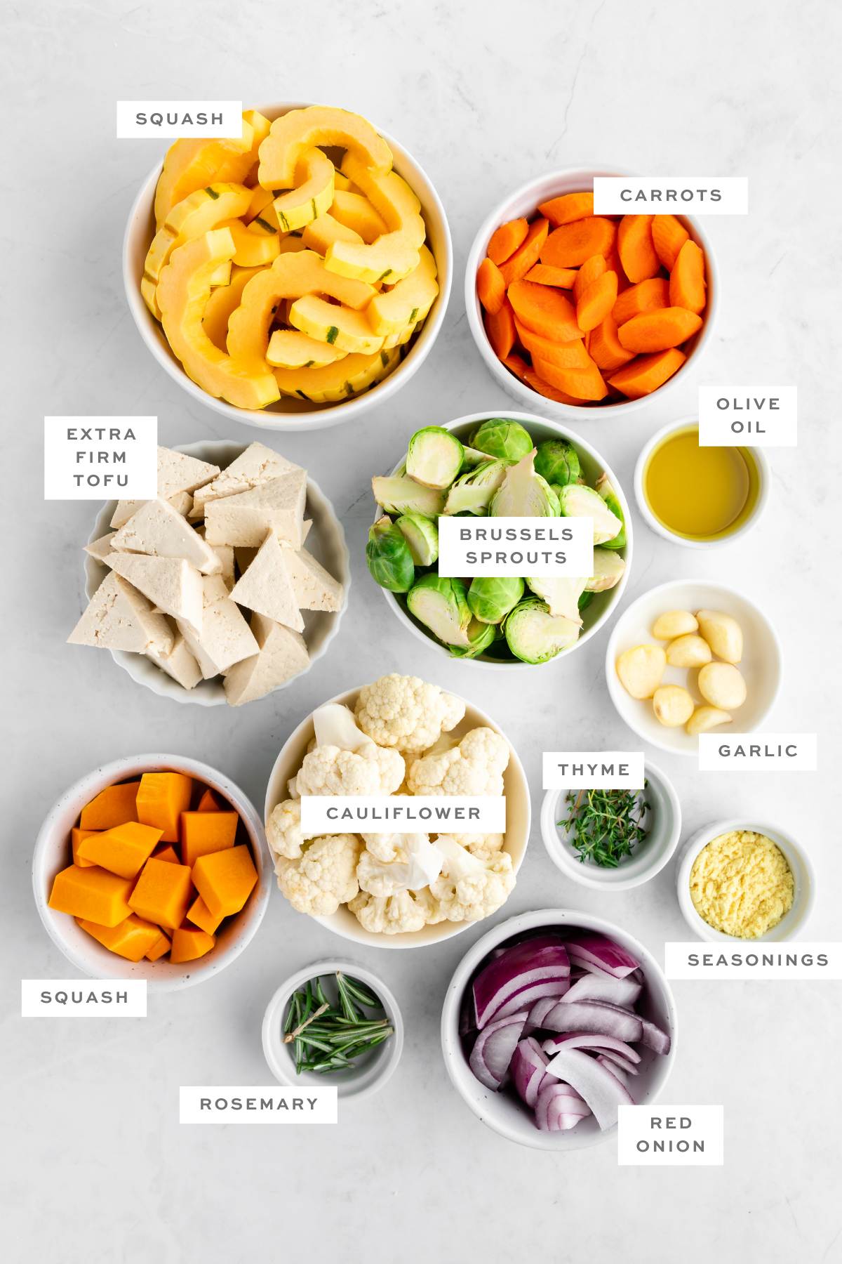 The gathered ingredients for this sheet pan tofu and veggies recipes, measured out and labeled.