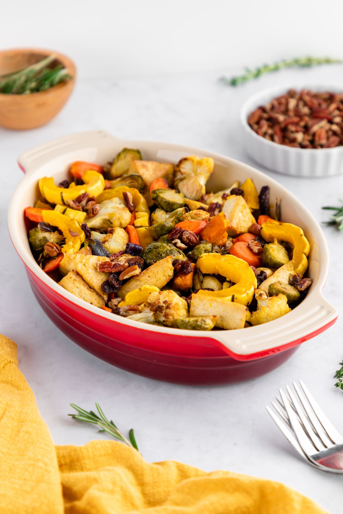 Sheet pan tofu and veggies served in a casserole dish.