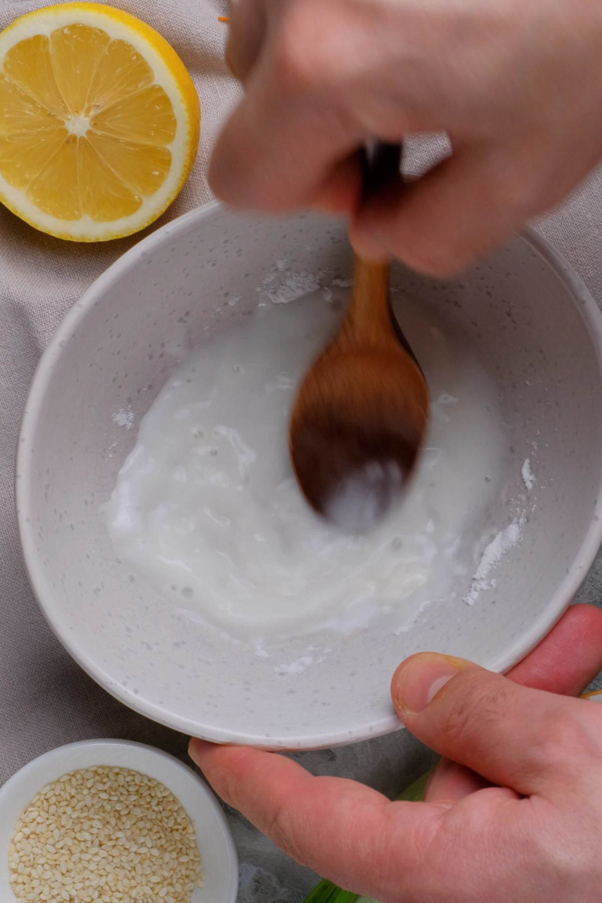 Cornstarch slurry being prepped in a bowl.