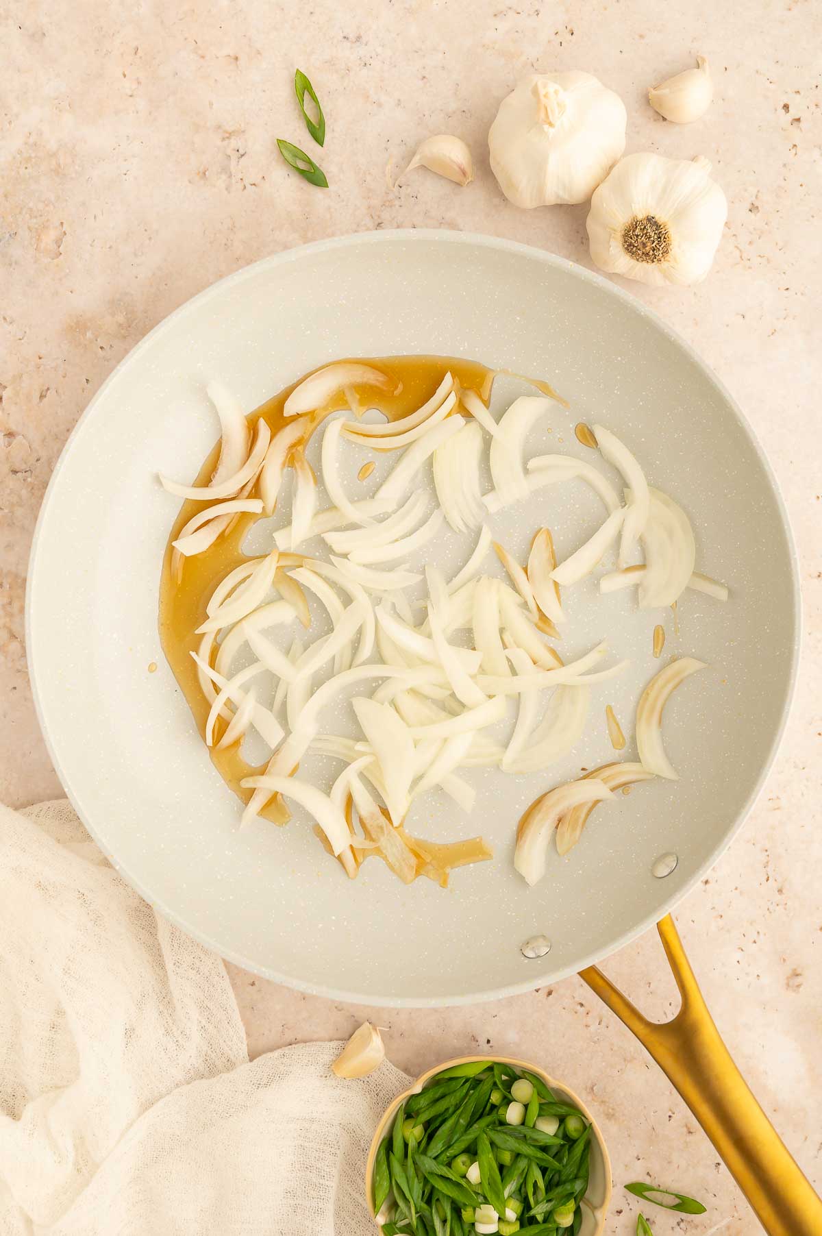 Onions starting to cook in sesame oil for a homemade teriyaki sauce base.