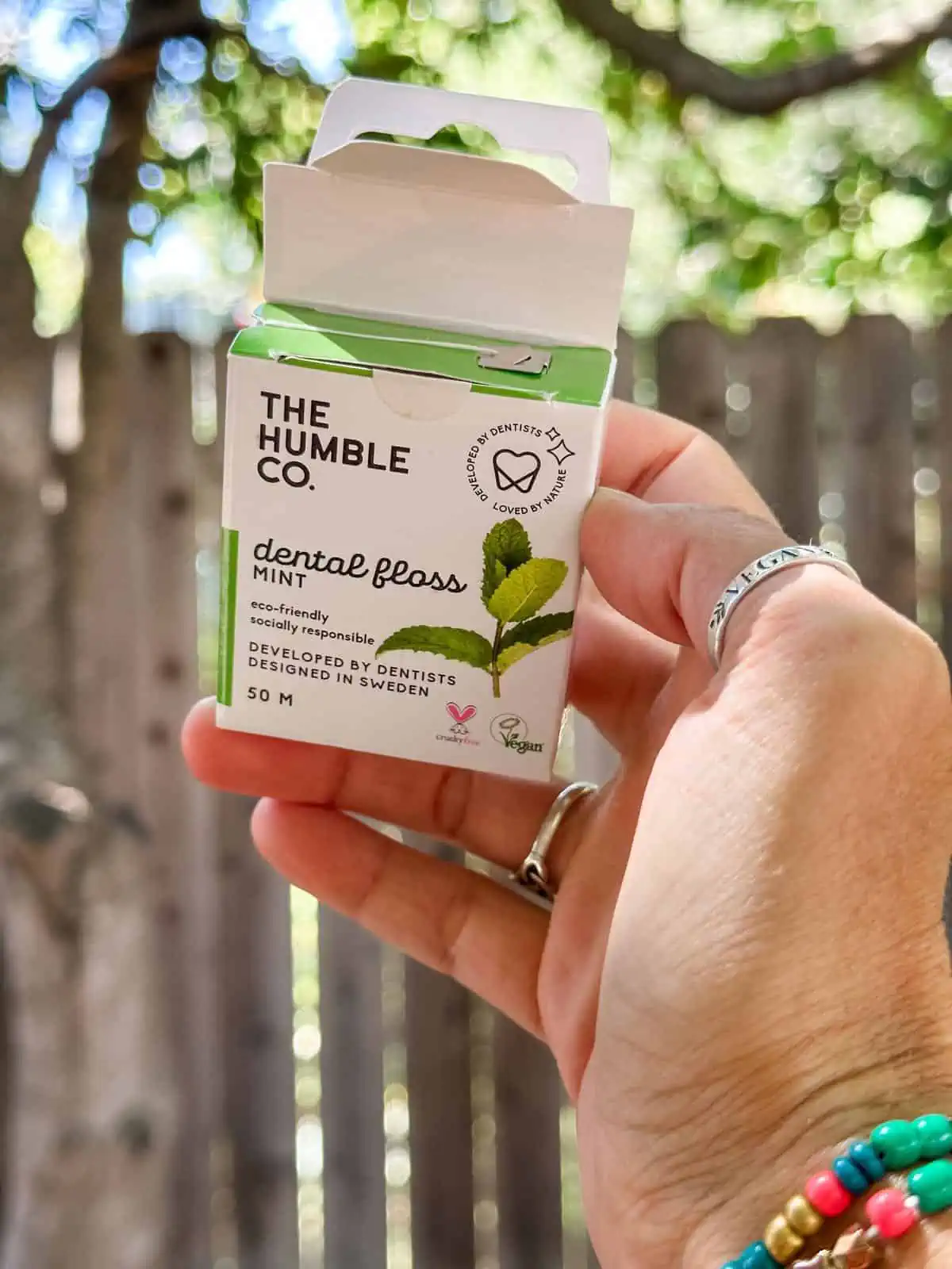 Open container of zero waste floss from the Humble Co.