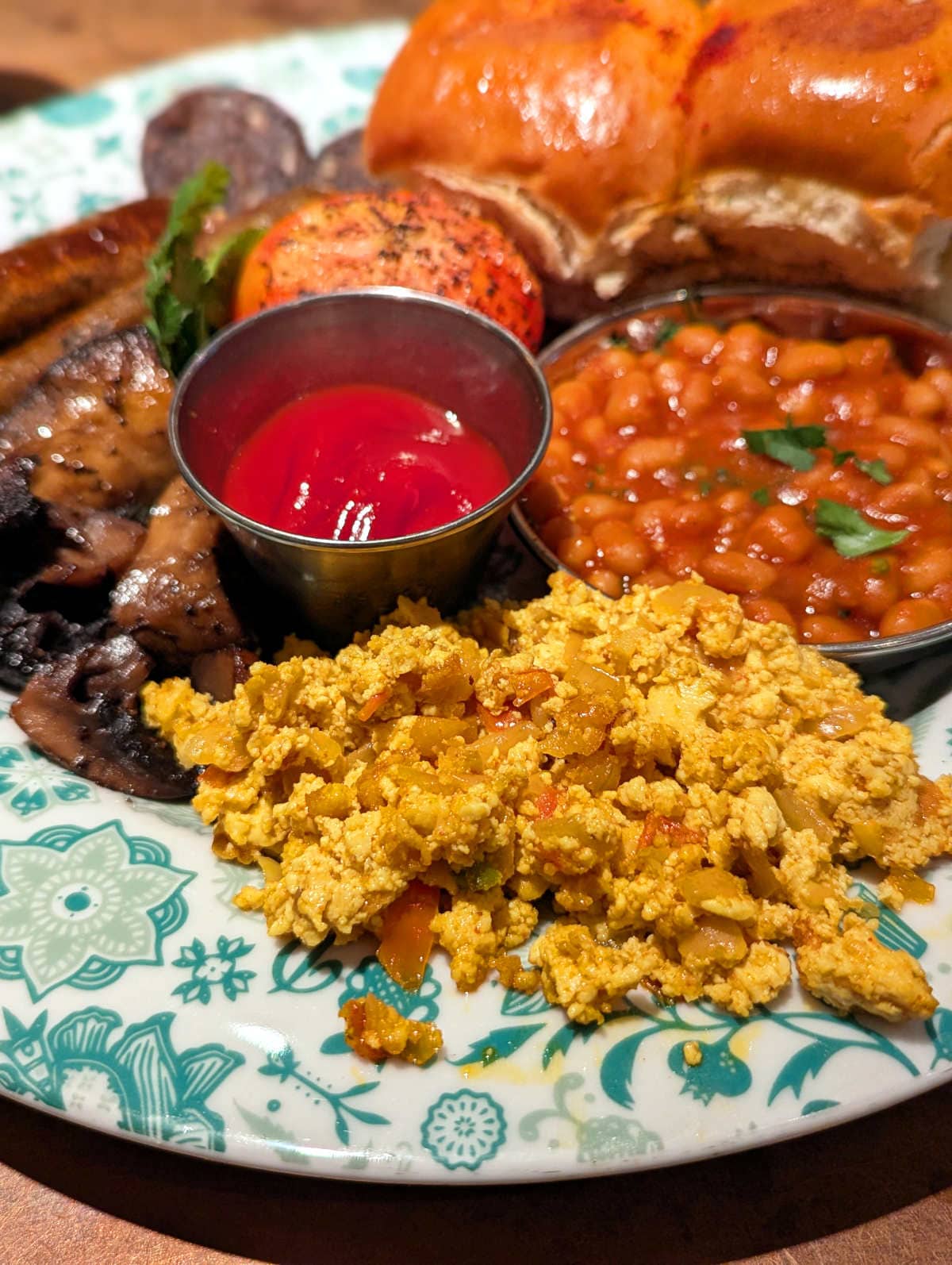 The Vegan Bombay breakfast at Dishoom with Tofu akuri, vegan sausages, vegan black pudding, grilled field mushrooms, masala beans, grilled tomato and home-made vegan buns.
