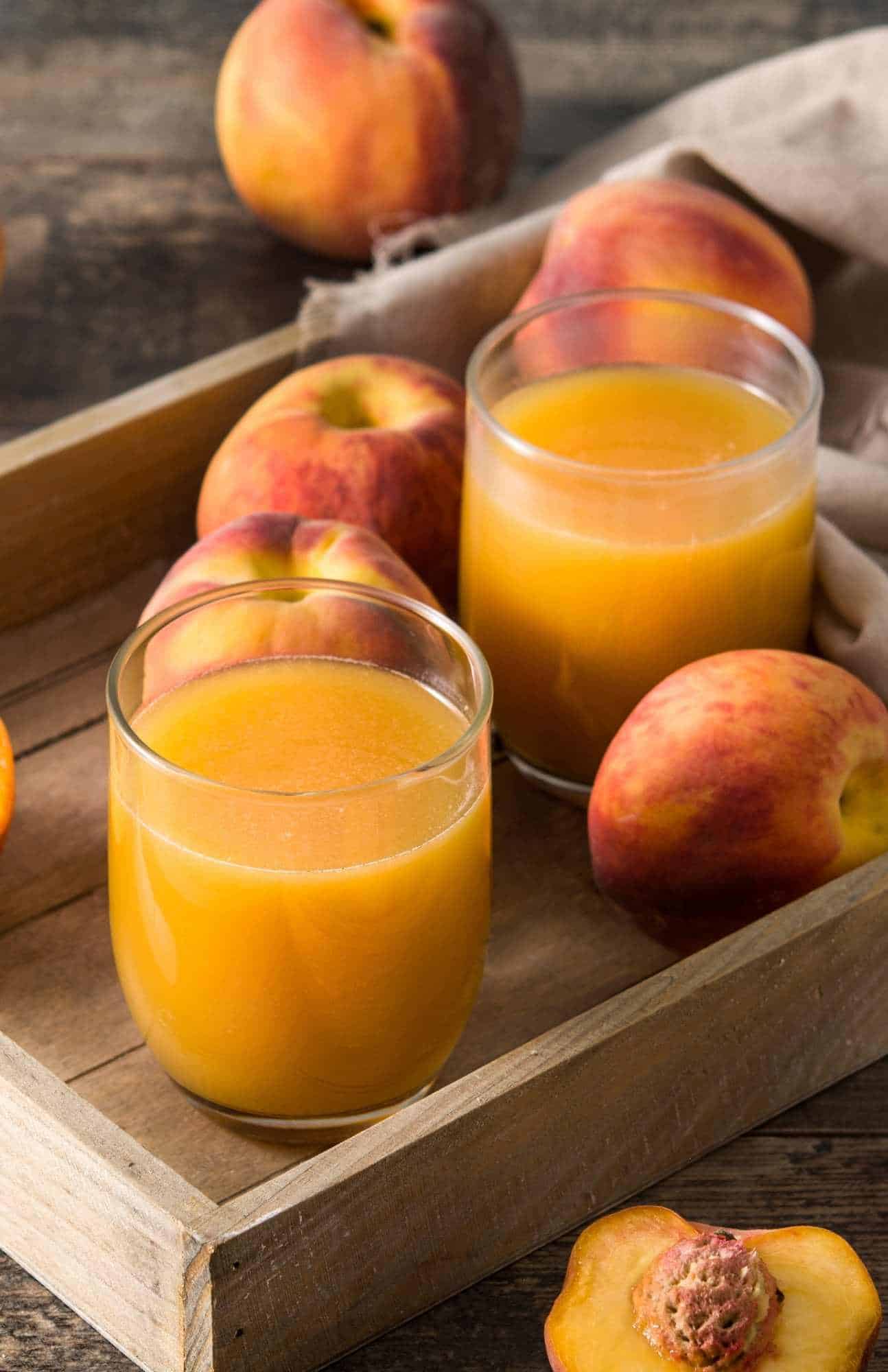 glasses of fresh homemade peach juice