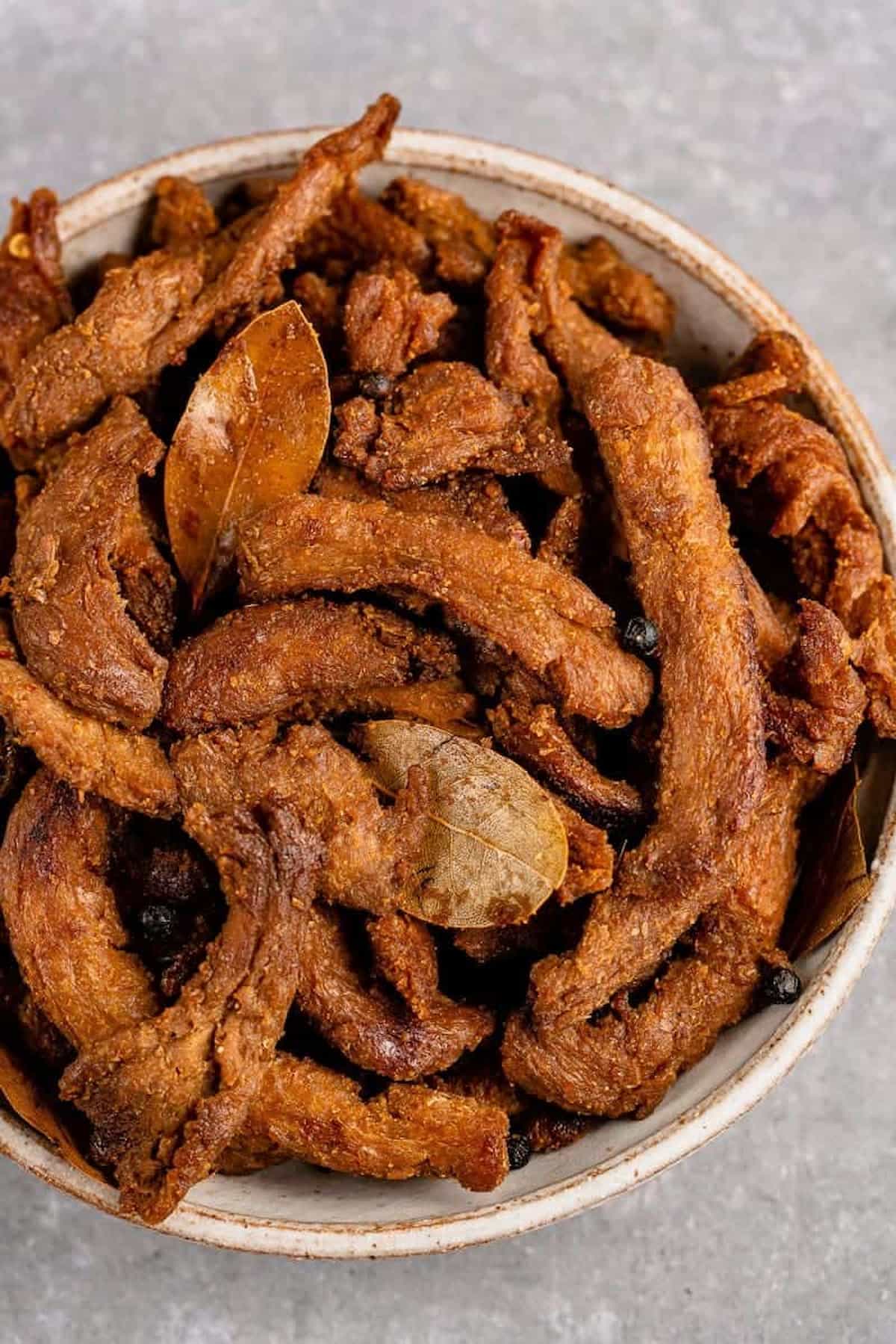 A bowl of vegan adobo jerky.