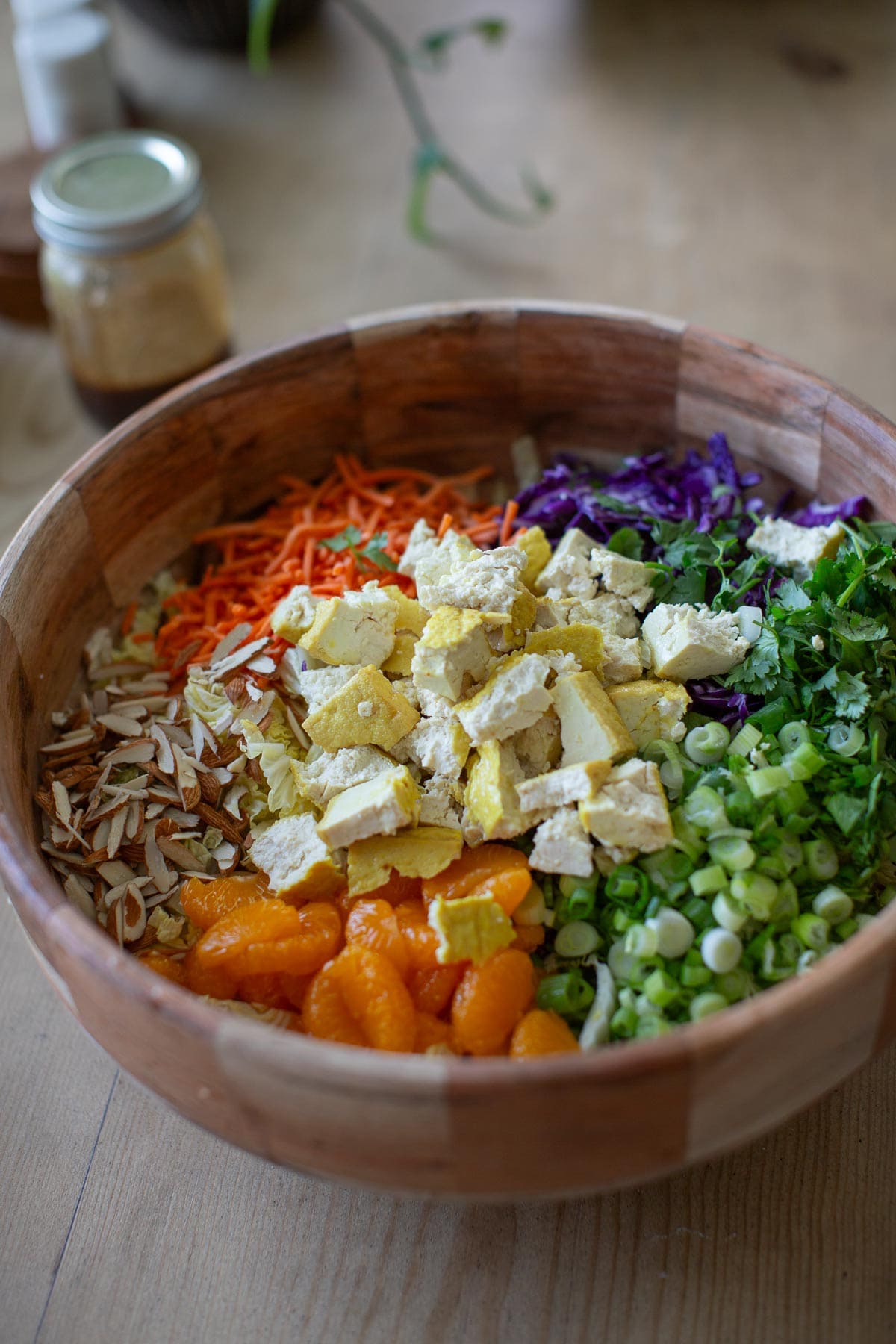 A bowl of vegan chinese chicken salad with tofu.