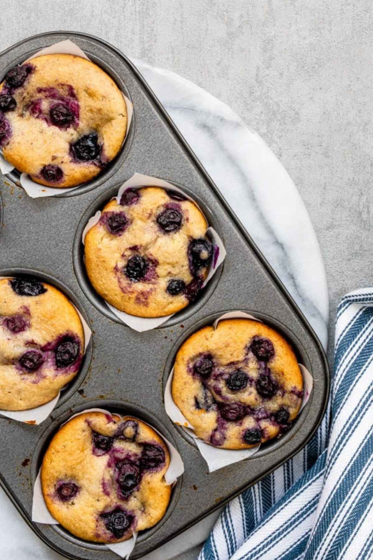 Fresh from the oven homemade vegan blueberry muffins.
