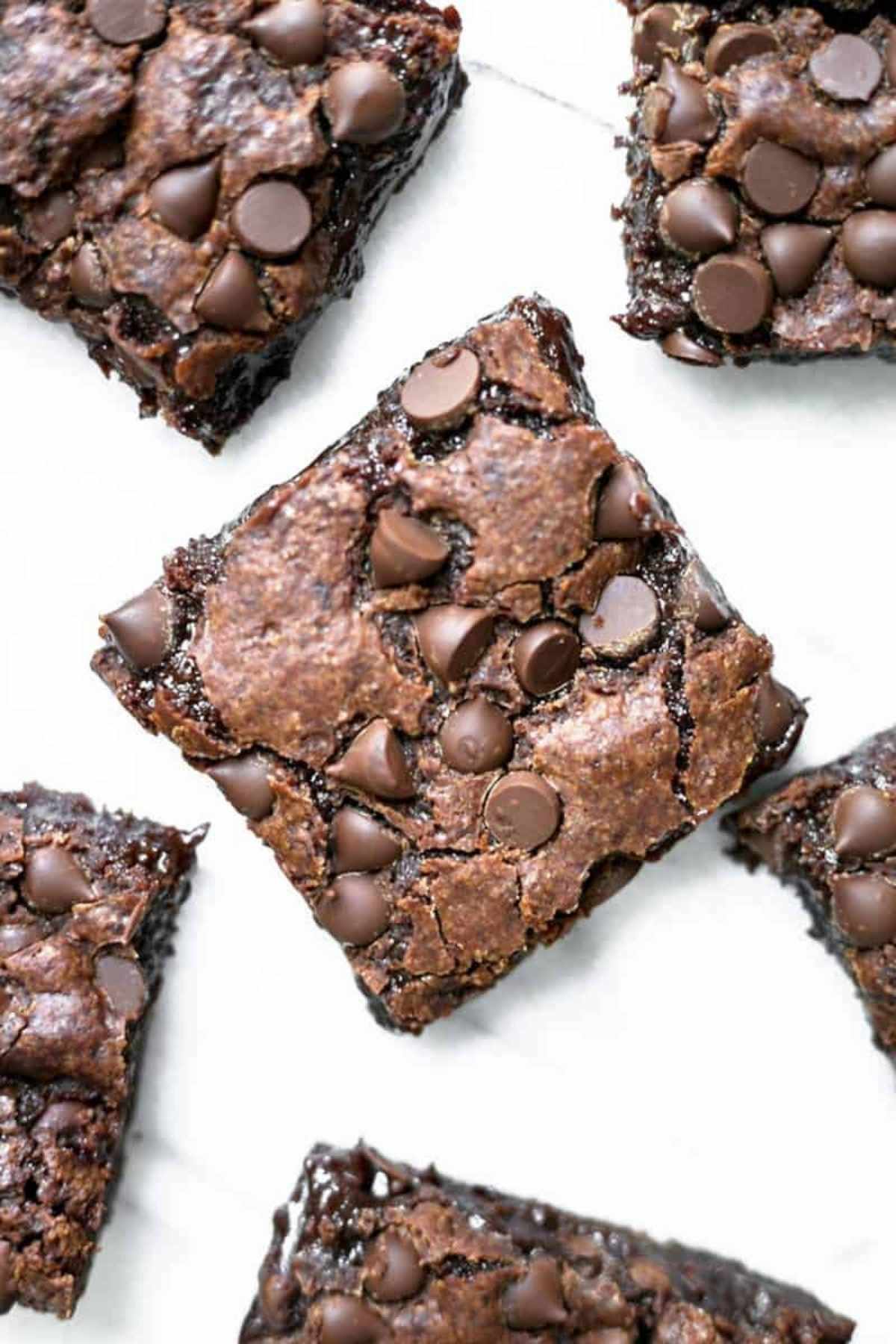 A top-down shot of homemade egg-free brownies with chocolate chips.