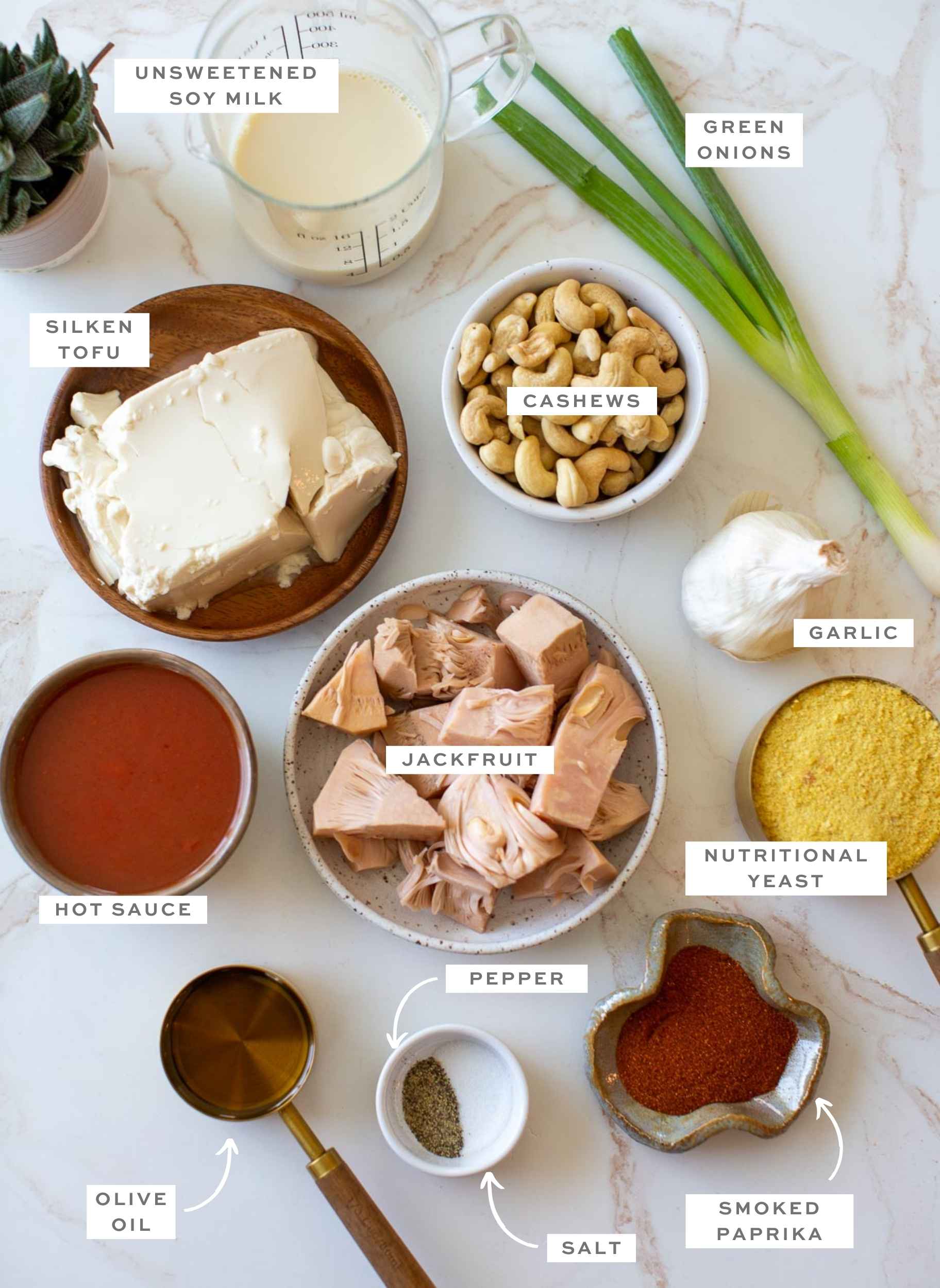 Gathered ingredients for this vegan buffalo chicken dip, measured out and labeled.