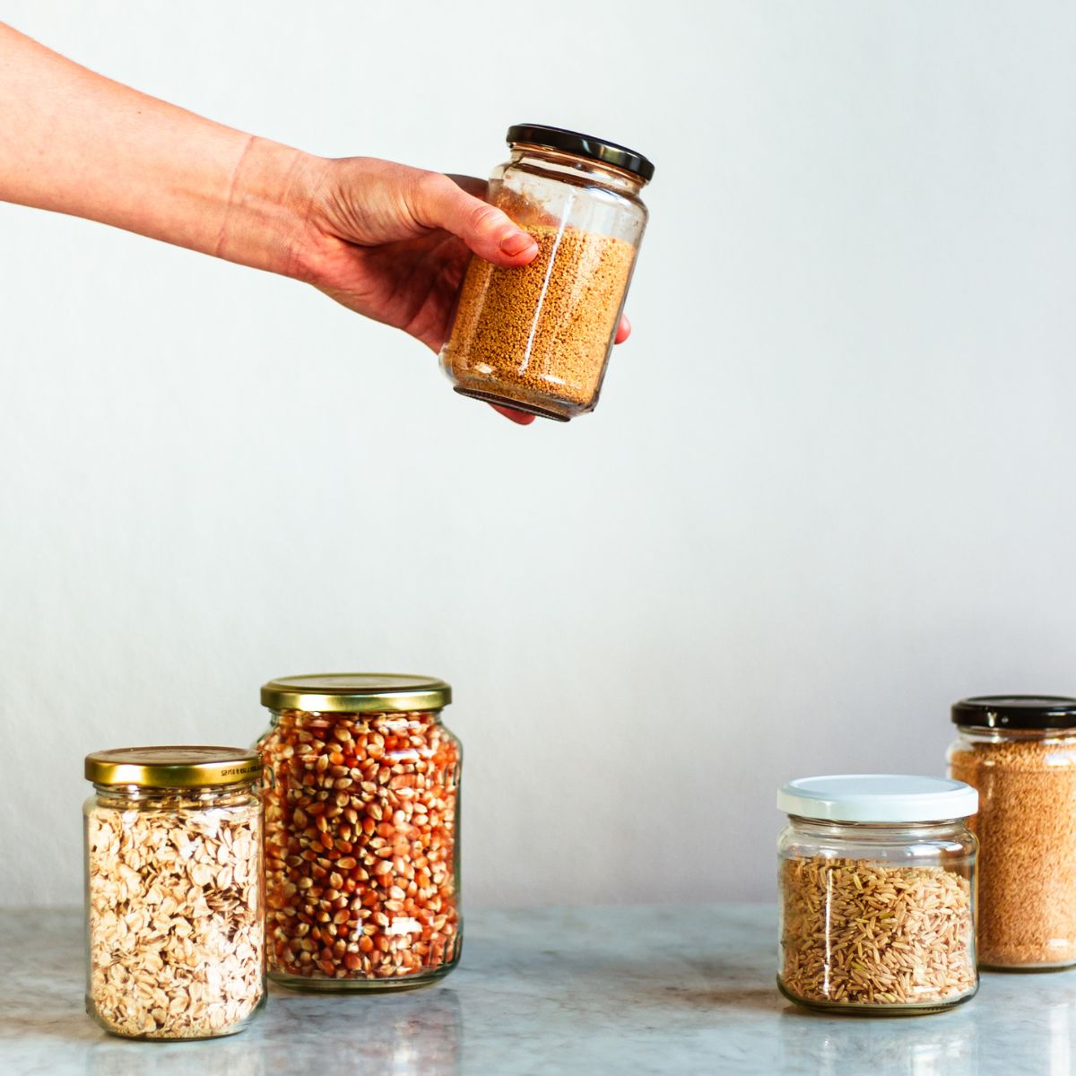 Jars of dry vegan pantry staples.