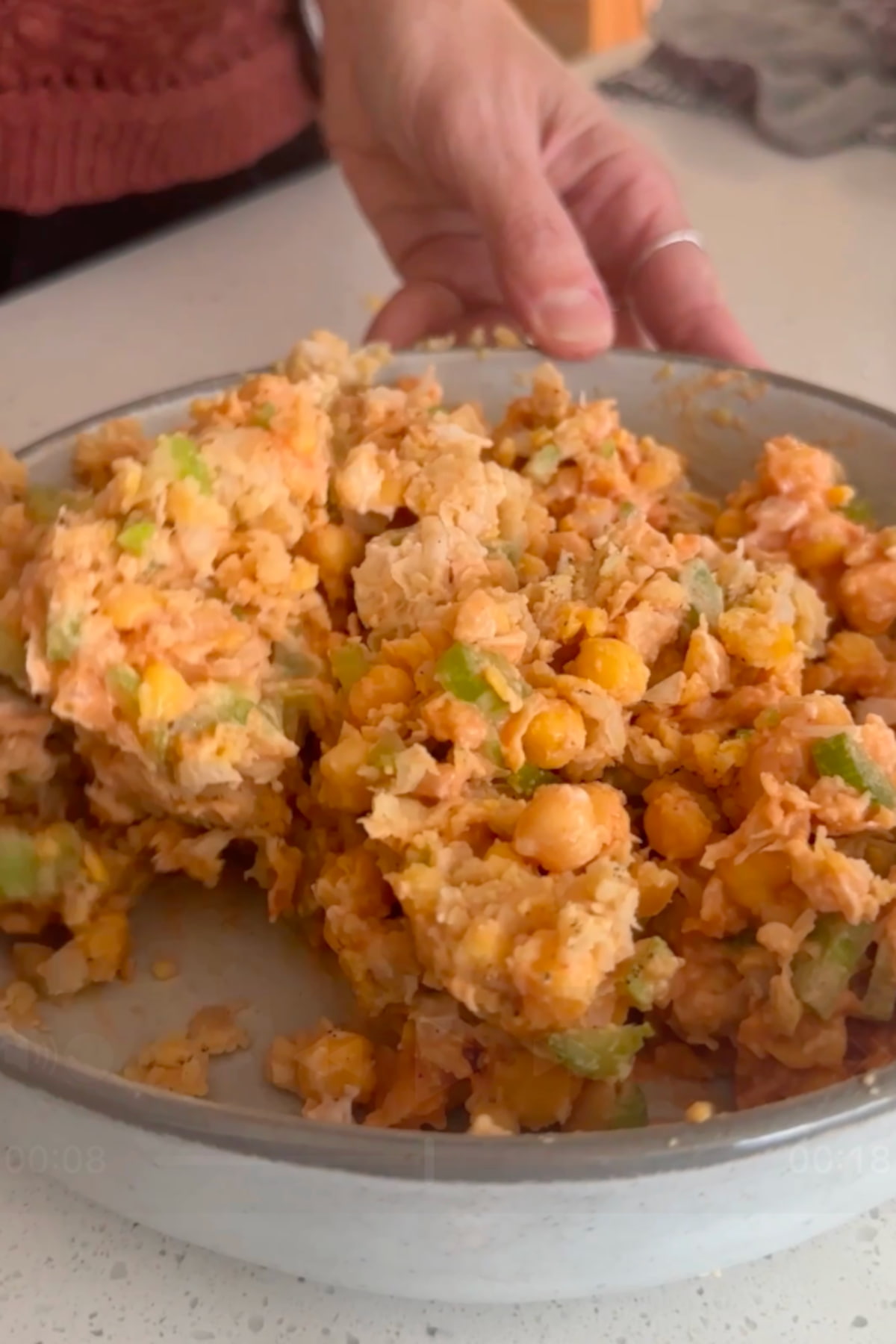 Buffalo chickpea filling all mixed together in a white bowl.