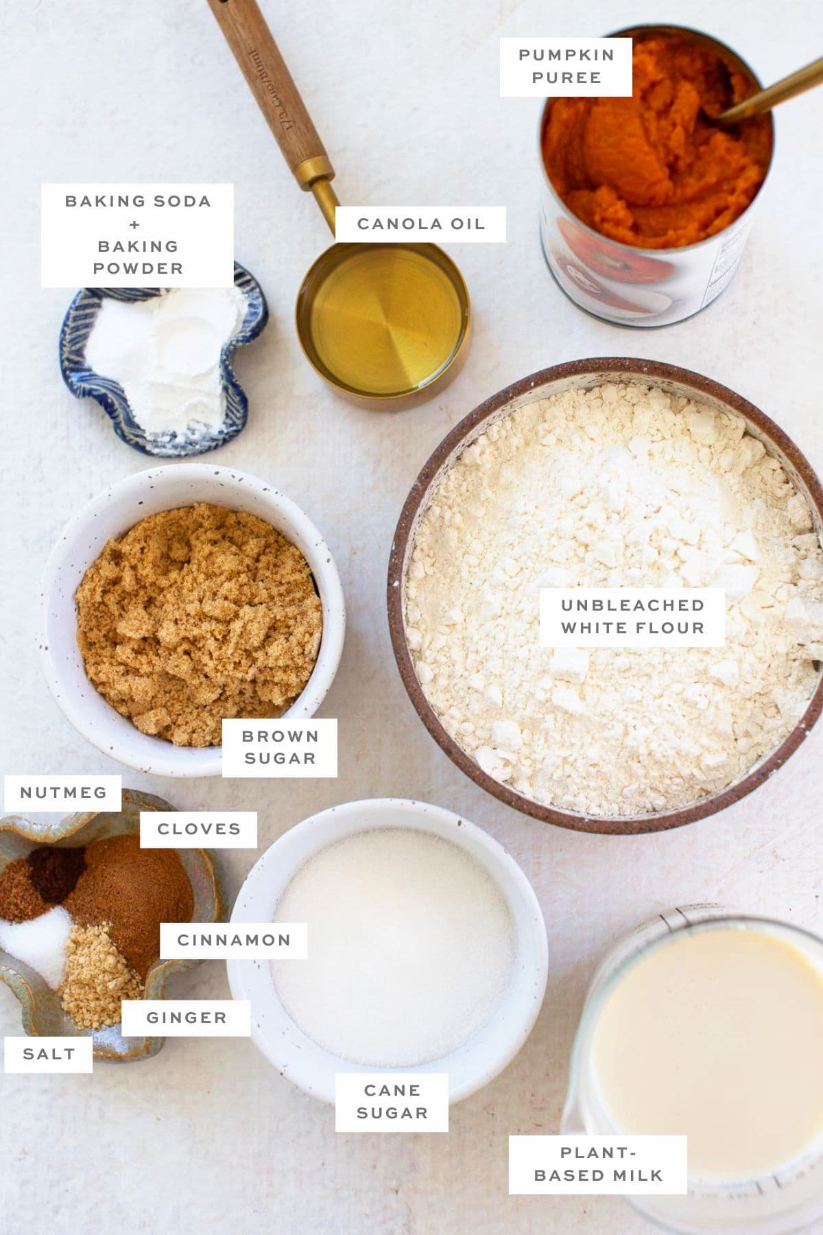 Gathered ingredients for vegan pumpkin waffles with labels.