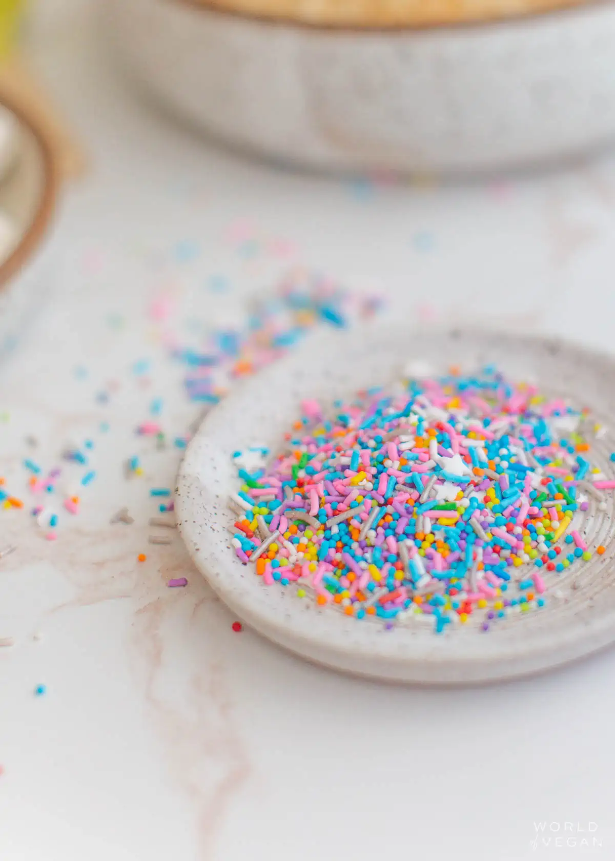 Dish of colorful rainbow vegan sprinkles.