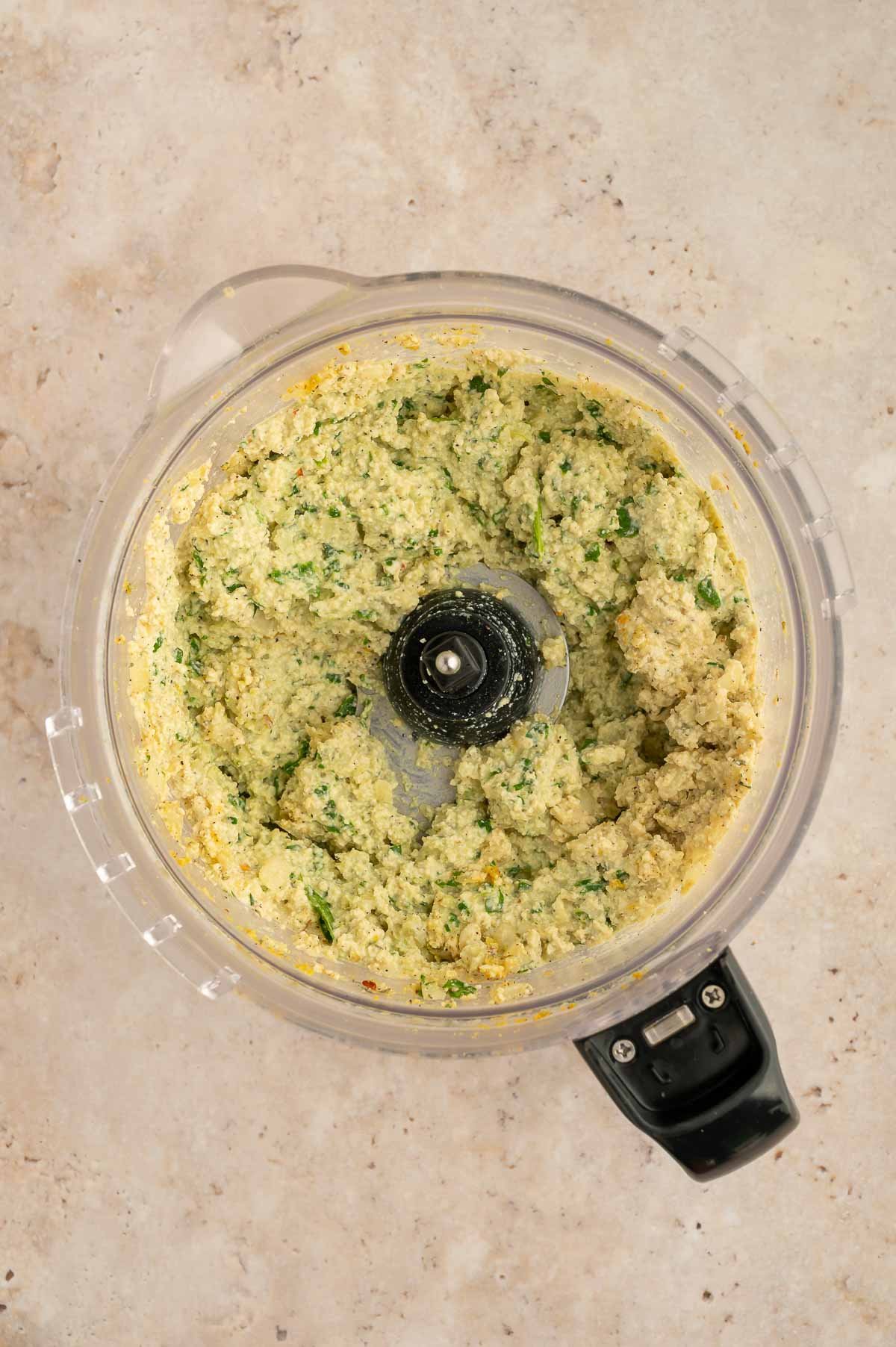 Blended homemade vegan ricotta in a food processor.