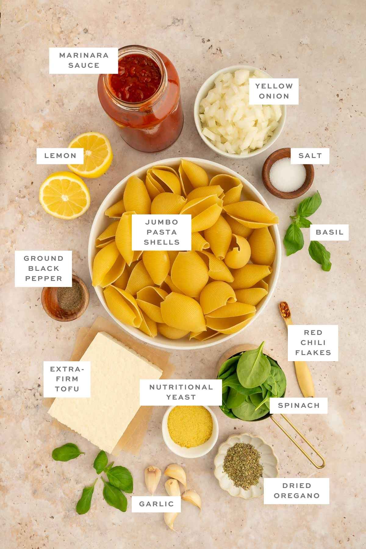 Key ingredients for vegan stuffed shells with labels.