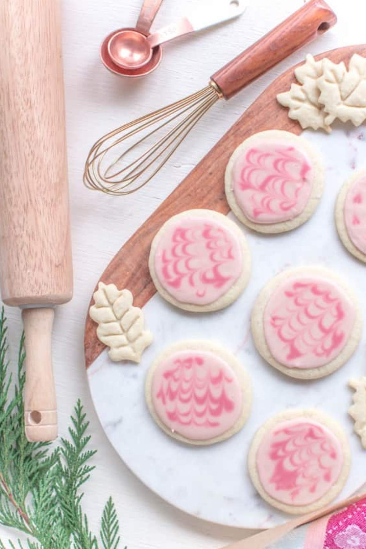 Round vegan sugar cookies with pink icing.