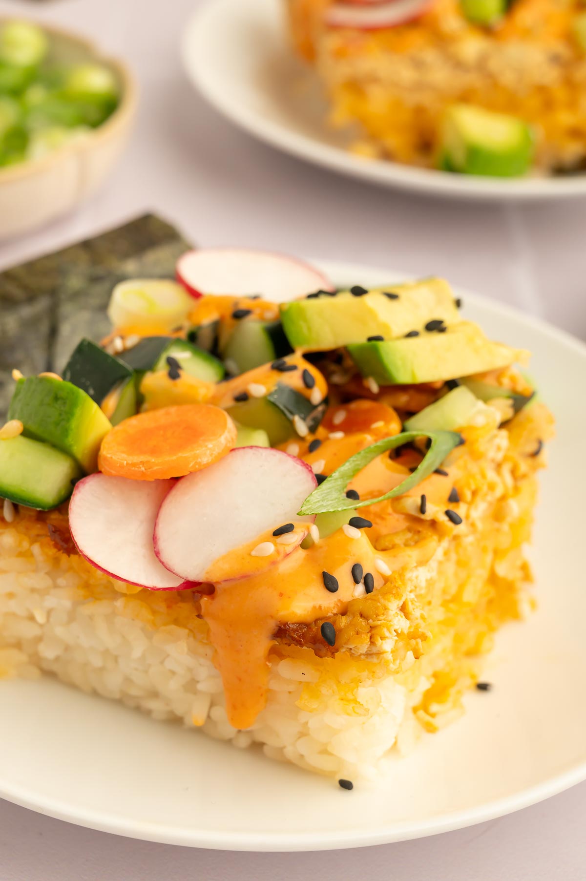 A slice of vegan sushi bake served on a plate.