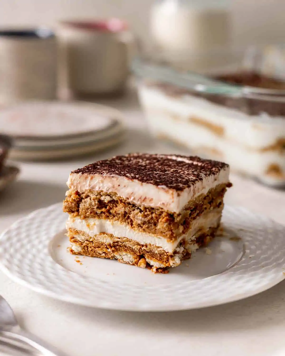 slice of vegan tiramisu on a plate