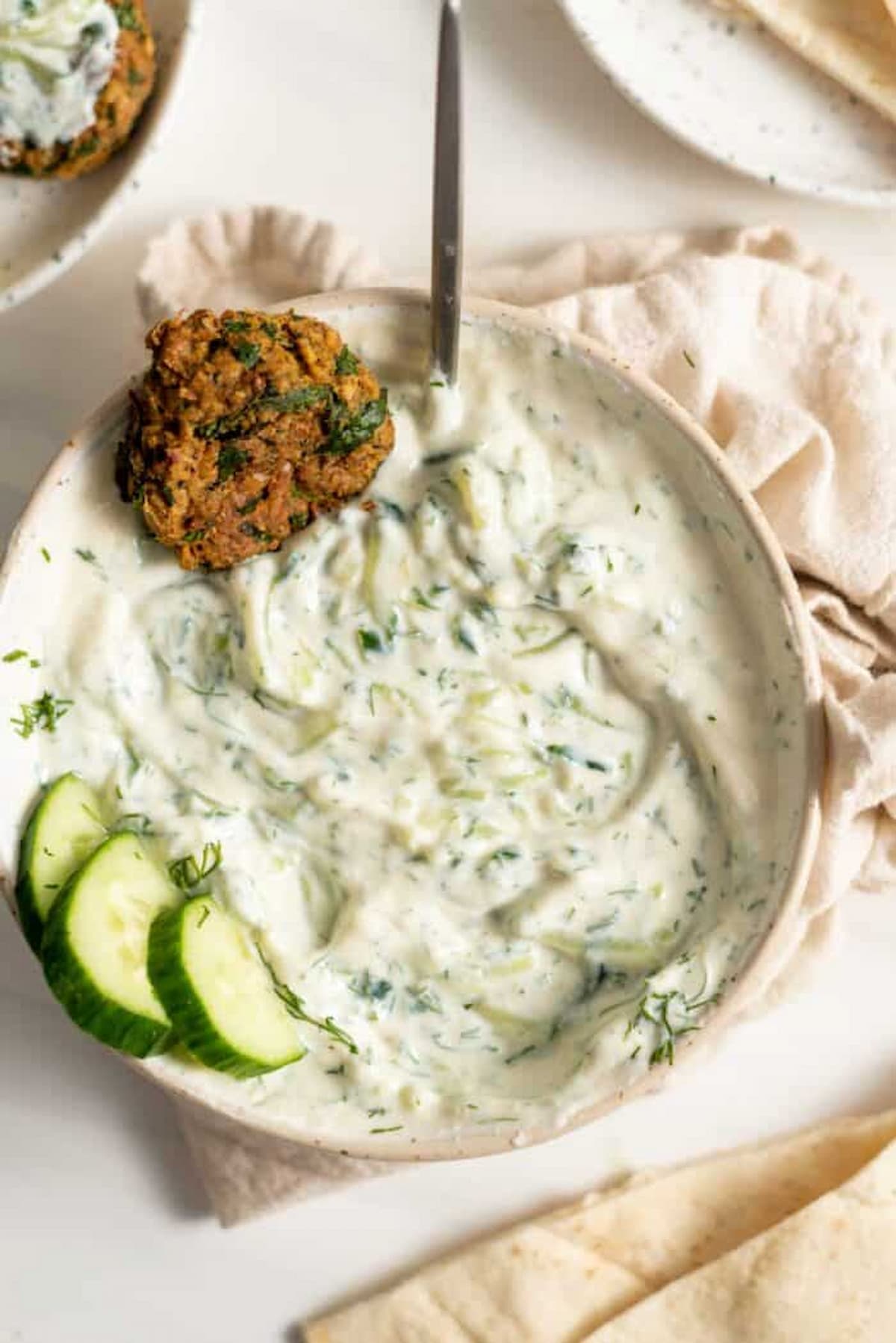 A bowl of vegan tzatziki, made with silken tofu.