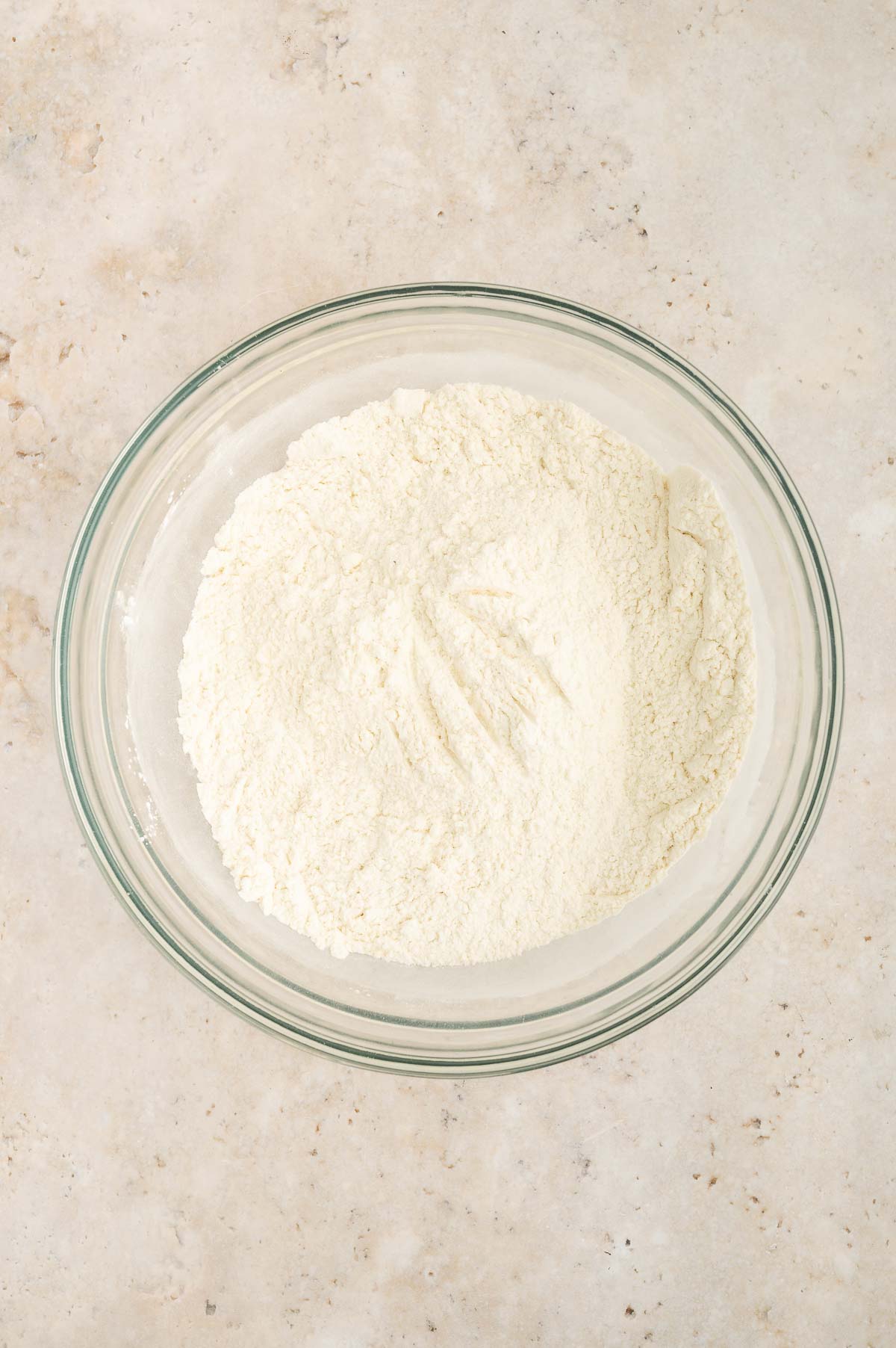 A bowl of dry ingredients for this vegan vanilla cake all whisked together.